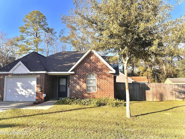 view of front facade featuring a garage and a front lawn