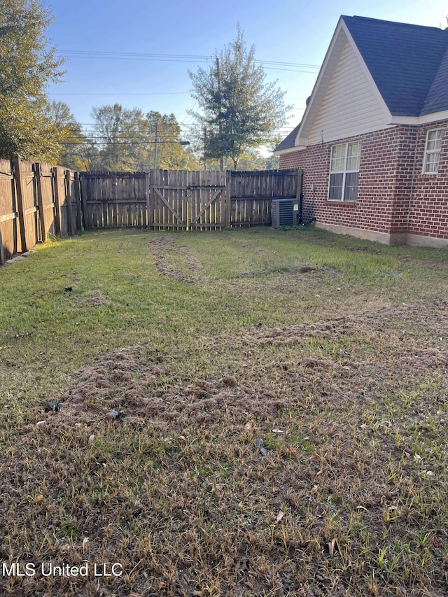 view of yard with central air condition unit