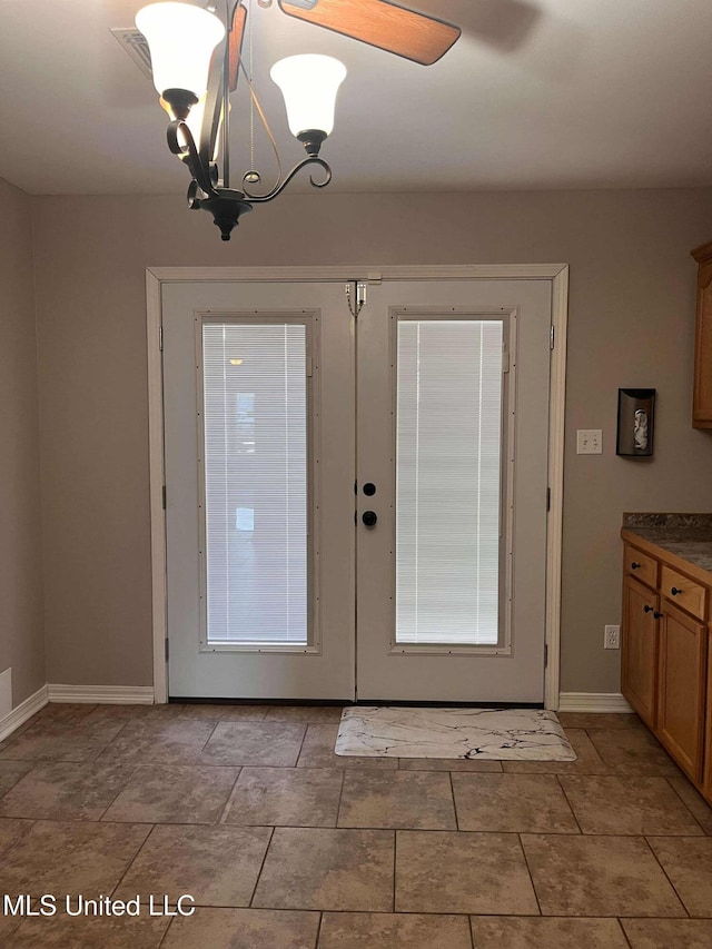 703 E Canal St, Picayune, MS 39466 - doorway to outside with a chandelier and french doors