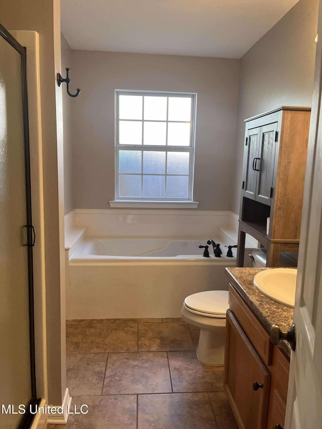 full bathroom featuring tile patterned floors, vanity, toilet, and plus walk in shower