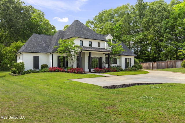 302 Covington Cv, Madison, MS 39110 - french provincial home featuring a standing seam roof, driveway, and roof with shingles