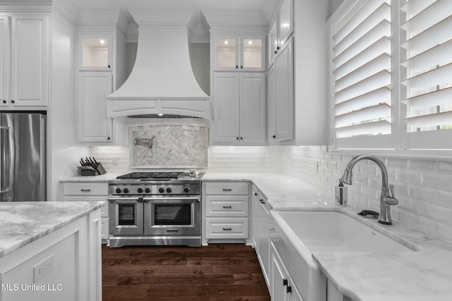 302 Covington Cv, Madison, MS 39110 - kitchen featuring custom exhaust hood, stainless steel appliances, white cabinetry, dark wood-style floors, and light stone countertops