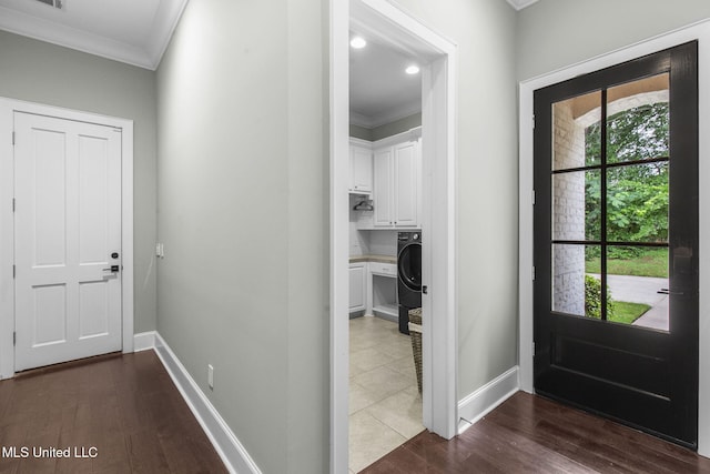 302 Covington Cv, Madison, MS 39110 - foyer entrance with crown molding, washer / dryer, and wood finished floors