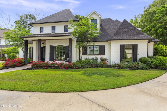 302 Covington Cv, Madison, MS 39110 - view of front facade with brick siding, roof with shingles, and a front lawn