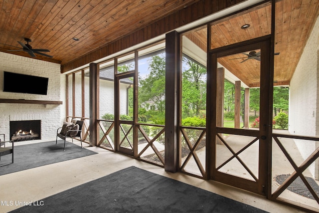 302 Covington Cv, Madison, MS 39110 - unfurnished sunroom with a fireplace and a ceiling fan