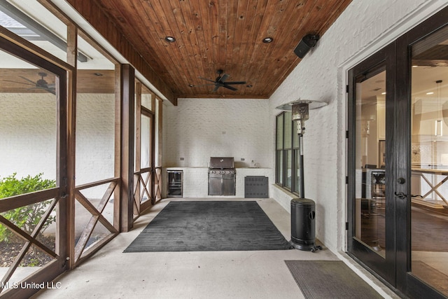 302 Covington Cv, Madison, MS 39110 - unfurnished sunroom featuring wood ceiling, area for grilling, a ceiling fan, wine cooler, and finished concrete flooring