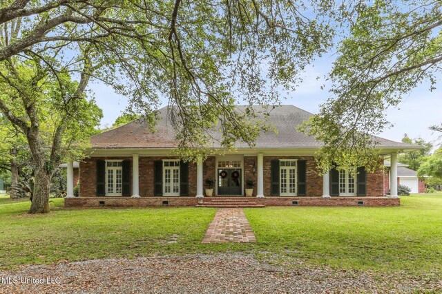 421 Starling Dr, Slidell, LA 70461 - view of front facade with roof with shingles, french doors, crawl space, a front yard, and brick siding