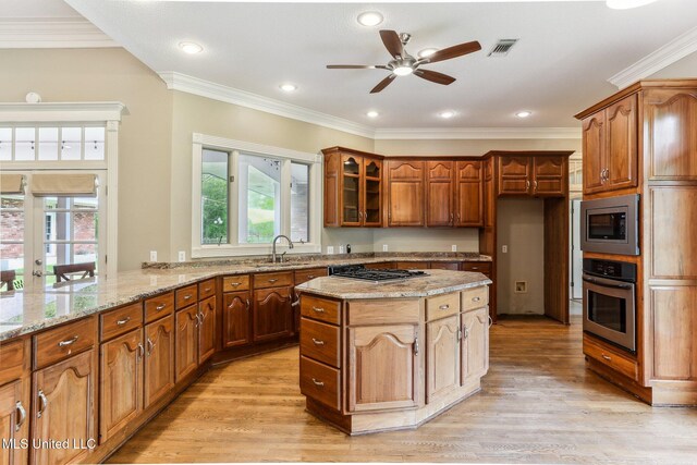 421 Starling Dr, Slidell, LA 70461 - kitchen featuring light stone counters, a sink, a ceiling fan, stainless steel appliances, and visible vents