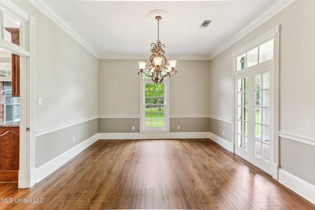 421 Starling Dr, Slidell, LA 70461 - unfurnished room featuring visible vents, a chandelier, crown molding, baseboards, and wood finished floors