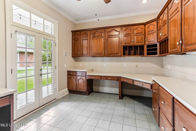 421 Starling Dr, Slidell, LA 70461 - kitchen featuring crown molding, light countertops, french doors, built in desk, and ceiling fan
