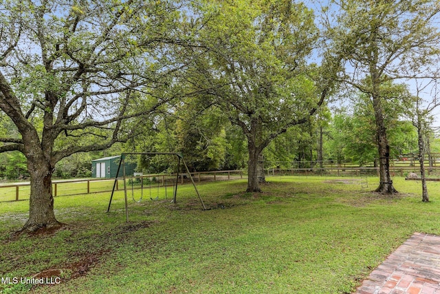 421 Starling Dr, Slidell, LA 70461 - view of yard featuring fence and a playground