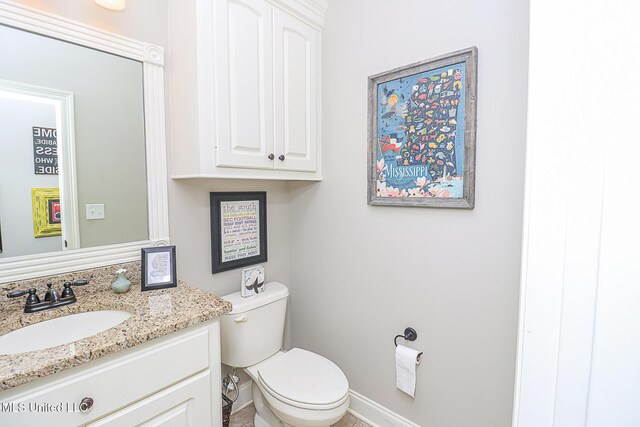 109 Elizabeth Dr, Brandon, MS 39042 - bathroom featuring vanity, toilet, and baseboards