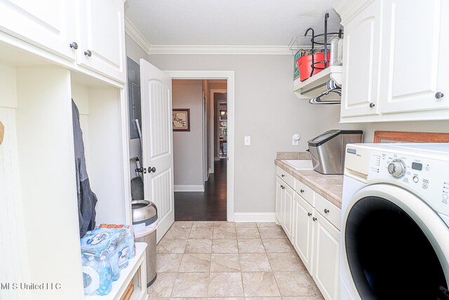 109 Elizabeth Dr, Brandon, MS 39042 - laundry room with washer / dryer, cabinet space, and ornamental molding