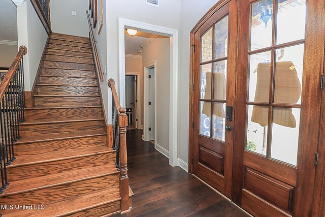 109 Elizabeth Dr, Brandon, MS 39042 - foyer entrance with crown molding, dark wood-type flooring, stairway, and baseboards