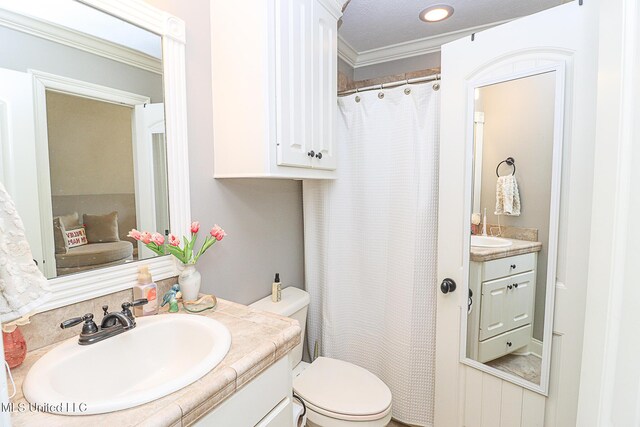 109 Elizabeth Dr, Brandon, MS 39042 - bathroom featuring vanity, toilet, ornamental molding, and a shower with shower curtain