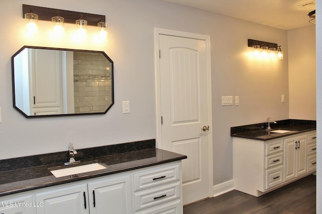 bathroom with vanity and wood-type flooring