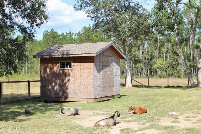 view of outbuilding with a lawn