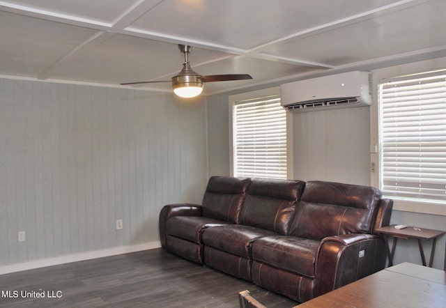 living room with a wall mounted AC, a wealth of natural light, and dark hardwood / wood-style floors