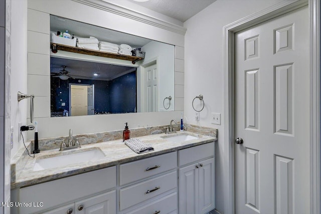 bathroom with ceiling fan and vanity