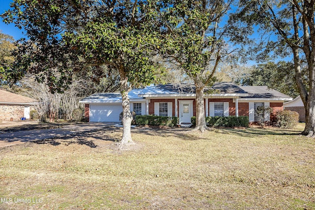 single story home with a front yard and a garage