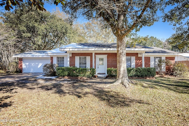 single story home featuring a garage and a front lawn