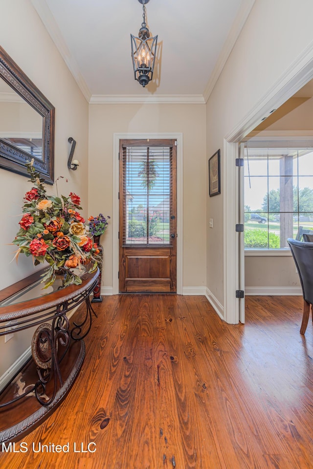 127 Palin Dr, Madison, MS 39110 - foyer with a chandelier, wood finished floors, and ornamental molding
