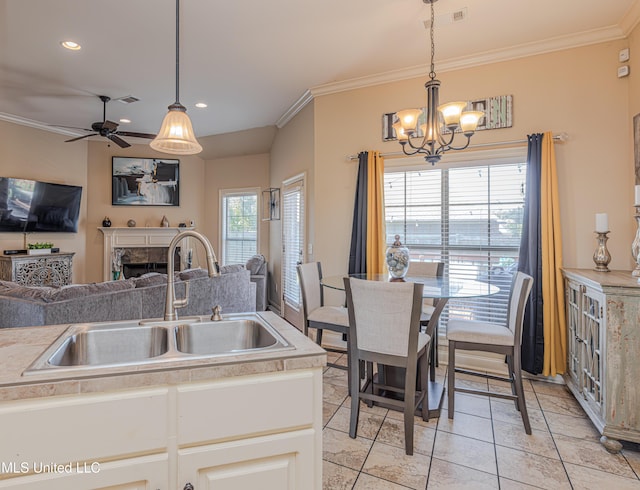 127 Palin Dr, Madison, MS 39110 - kitchen with a chandelier, open floor plan, ceiling fan, ornamental molding, and light tile patterned flooring