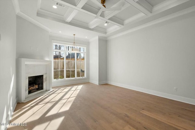 unfurnished living room with a fireplace, baseboards, coffered ceiling, and wood finished floors