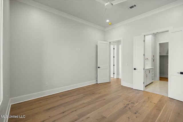 unfurnished bedroom with light wood finished floors, recessed lighting, visible vents, ornamental molding, and baseboards