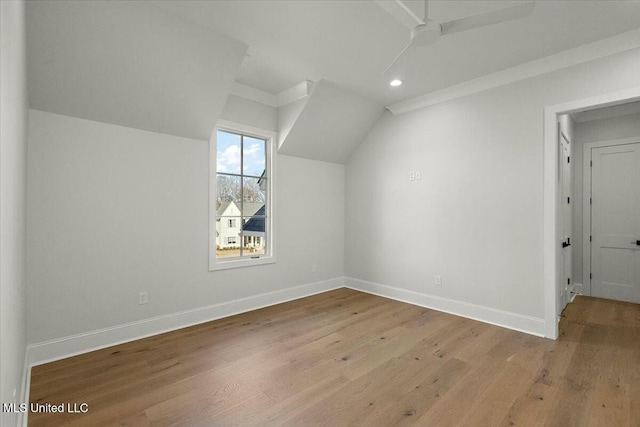 bonus room featuring vaulted ceiling, recessed lighting, wood finished floors, and baseboards