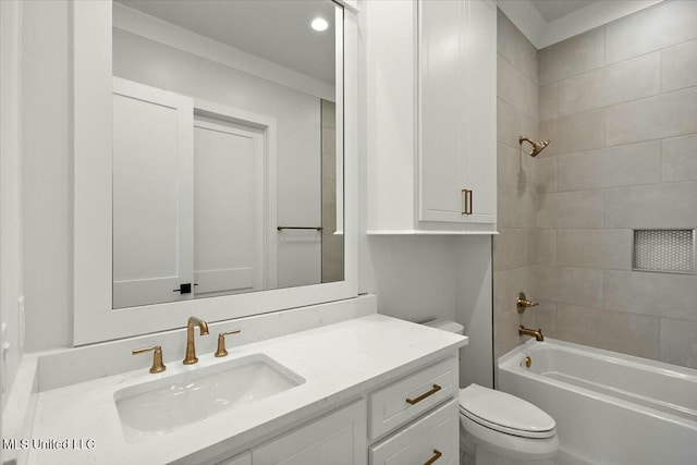 full bathroom featuring washtub / shower combination, vanity, and toilet