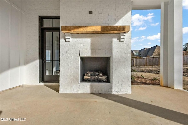 exterior space featuring an outdoor brick fireplace