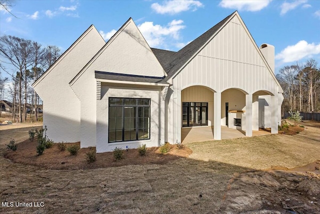 rear view of property with a patio area