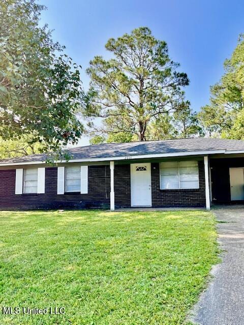 2614 George St, Gulfport, MS 39503 - ranch-style home featuring a front lawn, asphalt driveway, brick siding, and an attached carport