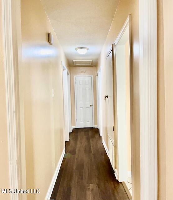 2614 George St, Gulfport, MS 39503 - hallway with dark wood finished floors and baseboards