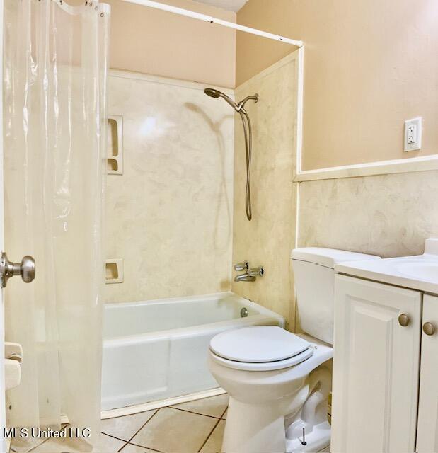 2614 George St, Gulfport, MS 39503 - full bathroom with shower / bath combo with shower curtain, toilet, vanity, and tile patterned floors
