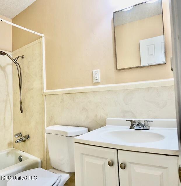 2614 George St, Gulfport, MS 39503 - bathroom featuring toilet, vanity, and bathtub / shower combination