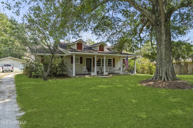 view of front facade featuring a front yard and a porch