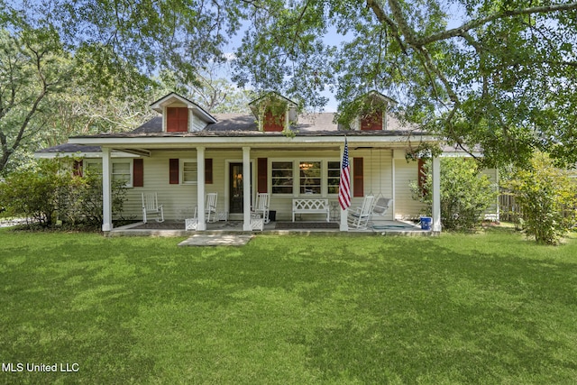 bungalow-style house featuring covered porch and a front lawn