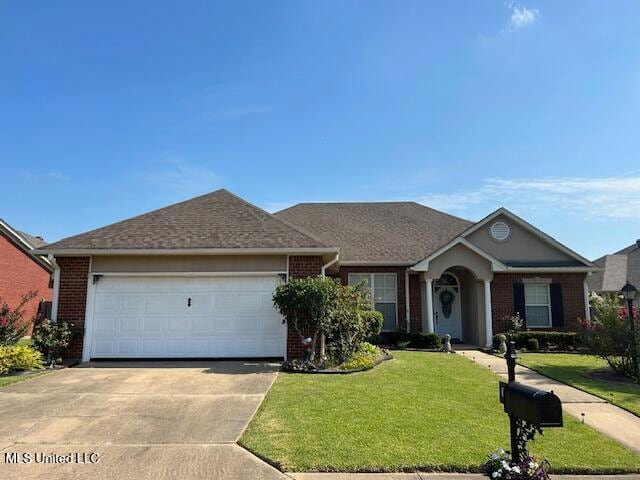 single story home with a front lawn and a garage