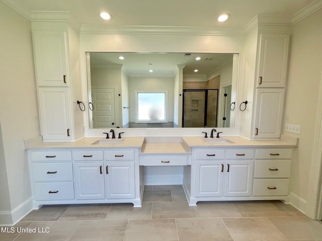 bathroom featuring vanity, tile patterned floors, ornamental molding, and a shower with shower door