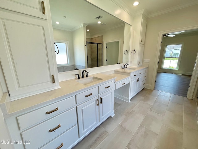 bathroom with vanity, an enclosed shower, wood-type flooring, and crown molding