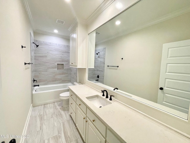 full bathroom featuring vanity, tiled shower / bath combo, ornamental molding, and toilet