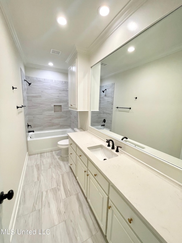 full bathroom featuring toilet, tiled shower / bath, ornamental molding, and vanity