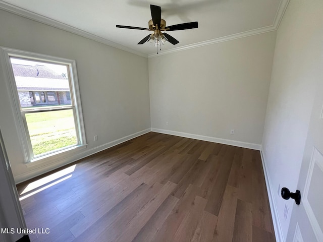 spare room with ornamental molding, wood-type flooring, and plenty of natural light