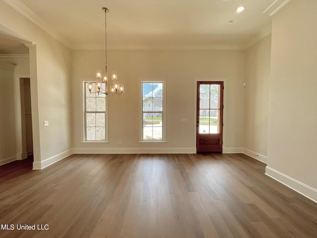 empty room featuring ornamental molding and dark hardwood / wood-style floors