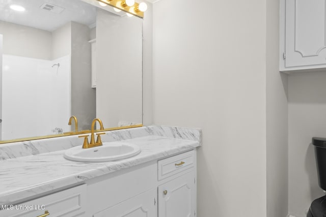 bathroom featuring visible vents and vanity