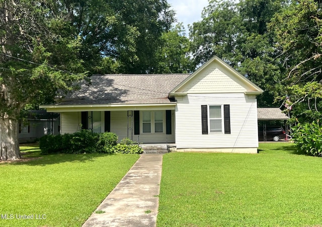 409 Coleman St, Como, MS 38619 - victorian home with a porch, a front lawn, and roof with shingles