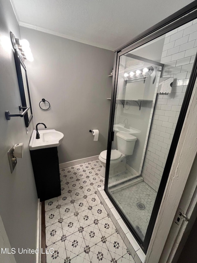 409 Coleman St, Como, MS 38619 - bathroom featuring a shower stall, vanity, tile patterned floors, a textured ceiling, and crown molding