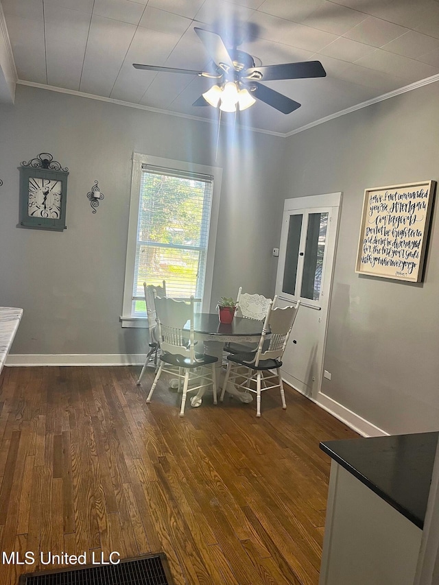 409 Coleman St, Como, MS 38619 - dining area with crown molding, ceiling fan, and wood finished floors